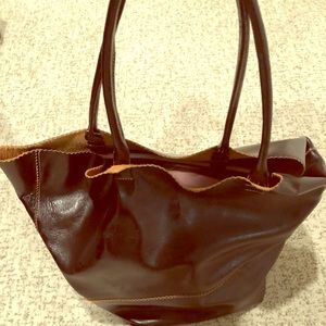 Large brown leather over-the-shoulder bucket bag